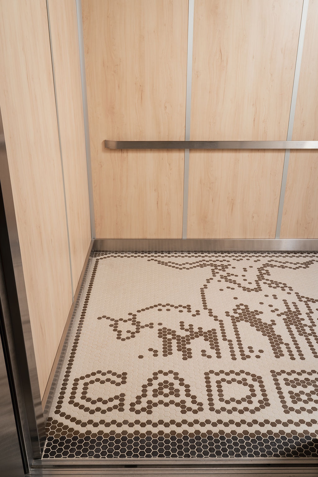 nic & juniors elevator tile