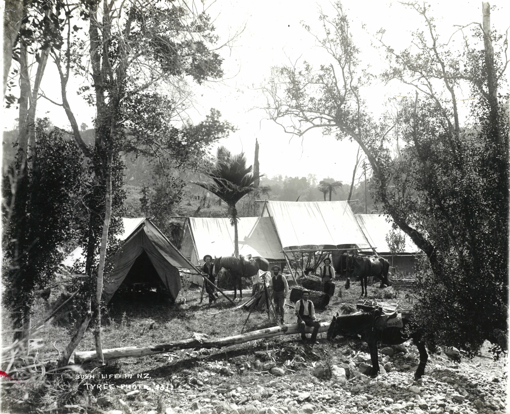 Surveying bush camp - men with surveying instruments