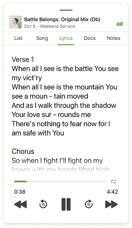 Lyrics displayed on a smartphone screen, showing a song titled "Battle Belongs." The verse and chorus are partially visible.