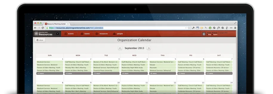 An open laptop displaying a full calendar with events listed out for each day. 