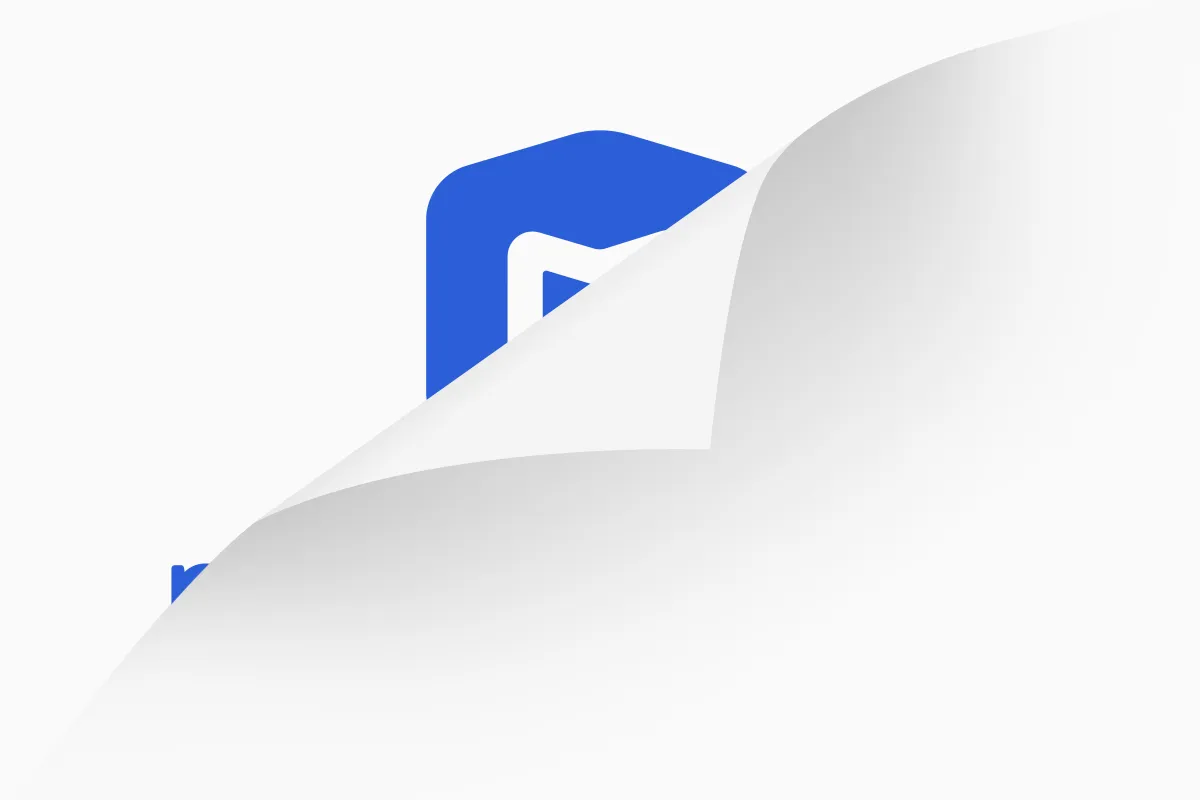 A white background peeling forward to slightly reveal part of a blue logo.