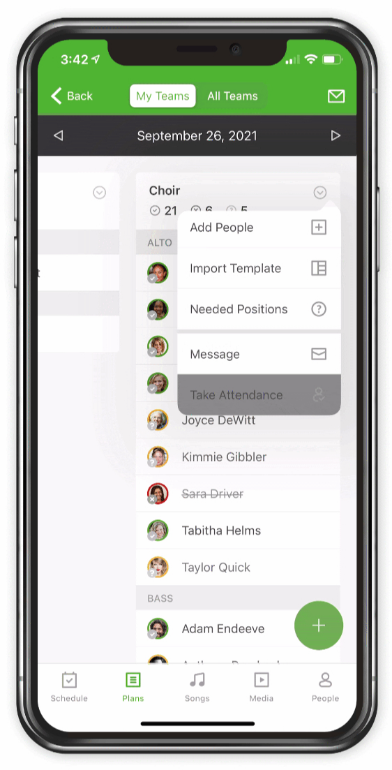 An iPhone with a list of team members scheduled for a service on a specific date. 