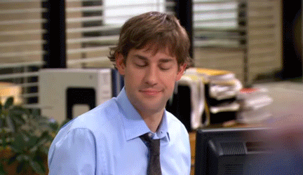 null A gif of Jim Halpert and Pam Beesly from The Office giving an air high-five.