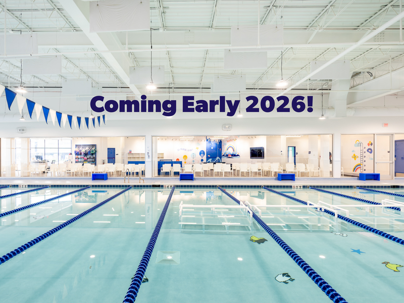 Swim instructor and student in water