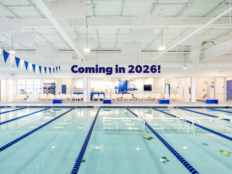 Swim instructor and student in water