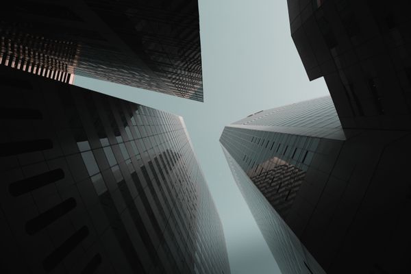 looking up at skyscrapers