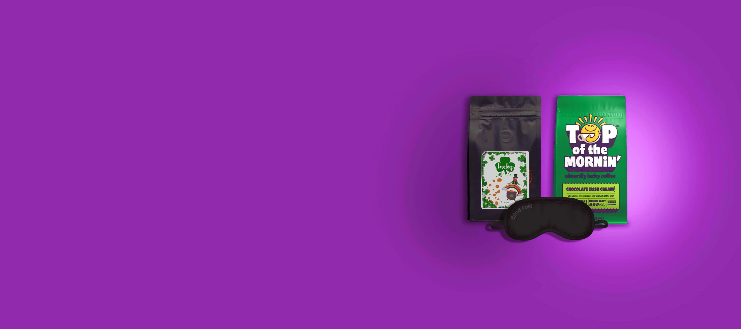 Flat Bottom coffee bags, one blank black with a label and another custom-printed bag with "Top of the Mornin." A black sleep mask is propped against the bags against a dark purple background.