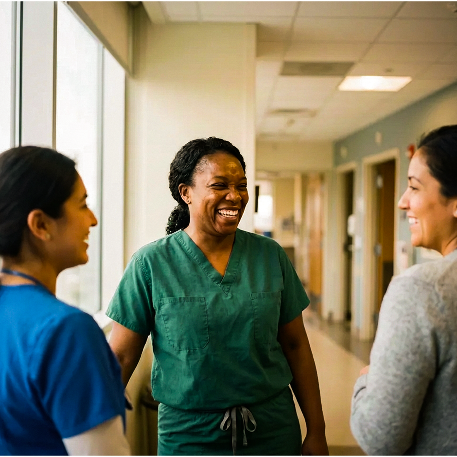 Nurses chatting in the hallway.