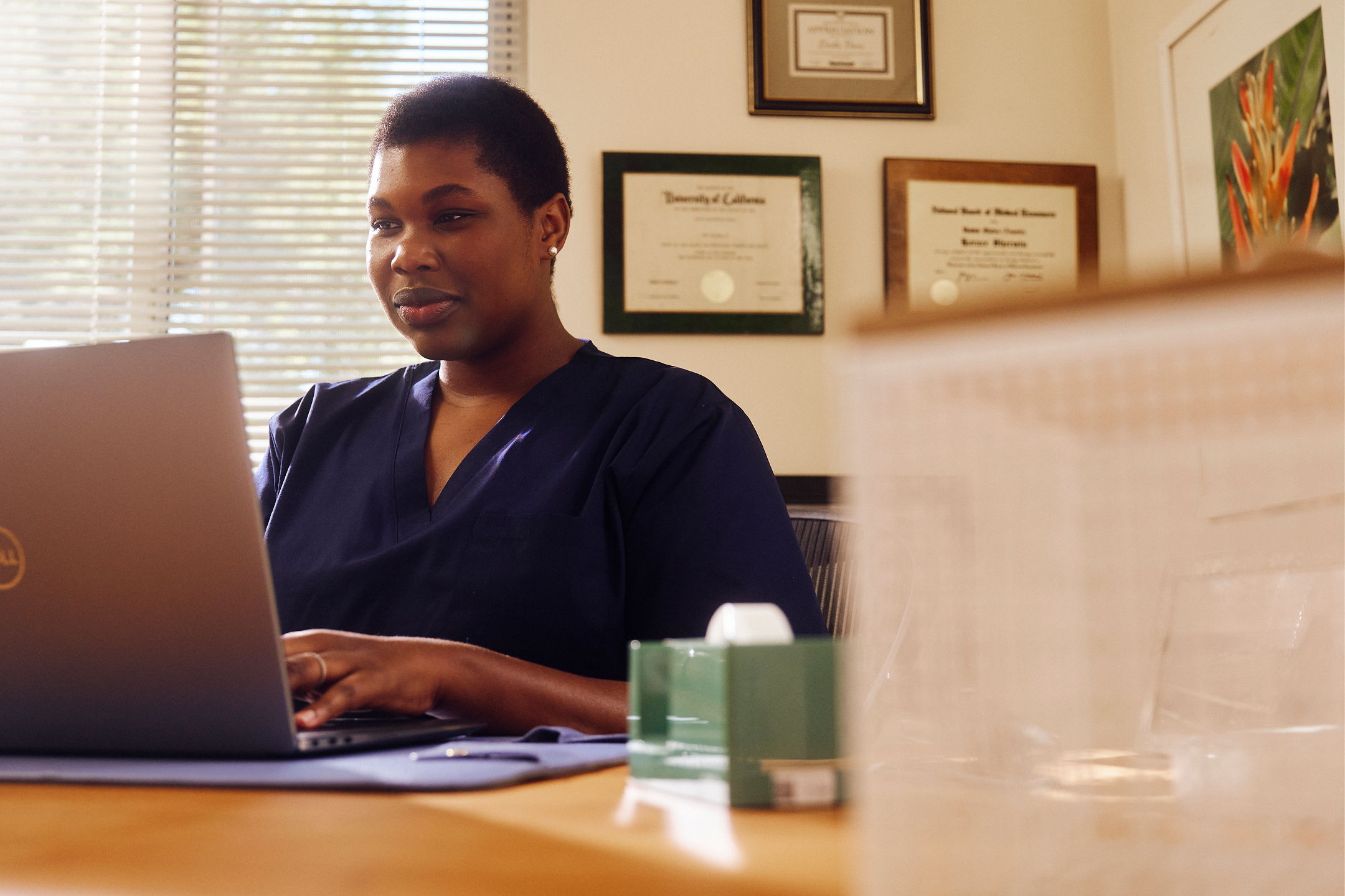 Nurse at a computer using the ShiftKey app