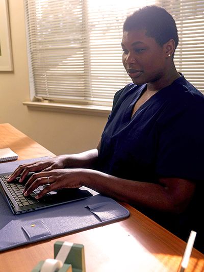 A scheduler works on a laptop