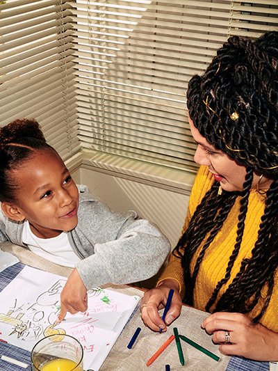 Mother and daughter engage in an activity