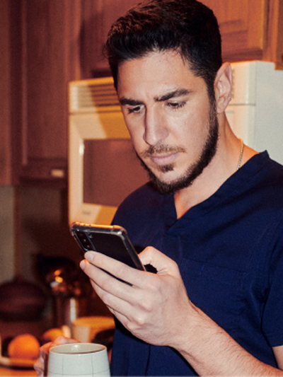 male nurse looking at phone