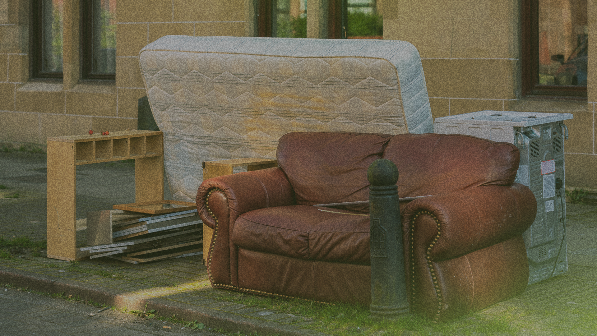 couch and mattress on the curb