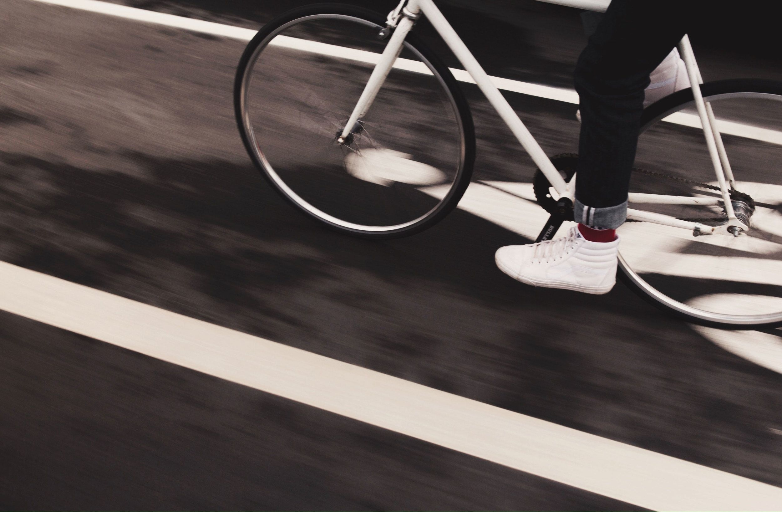 Photograph of cyclists feet as they accelerate.