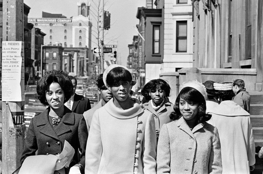 Photo from NYT archives of people walking along the street