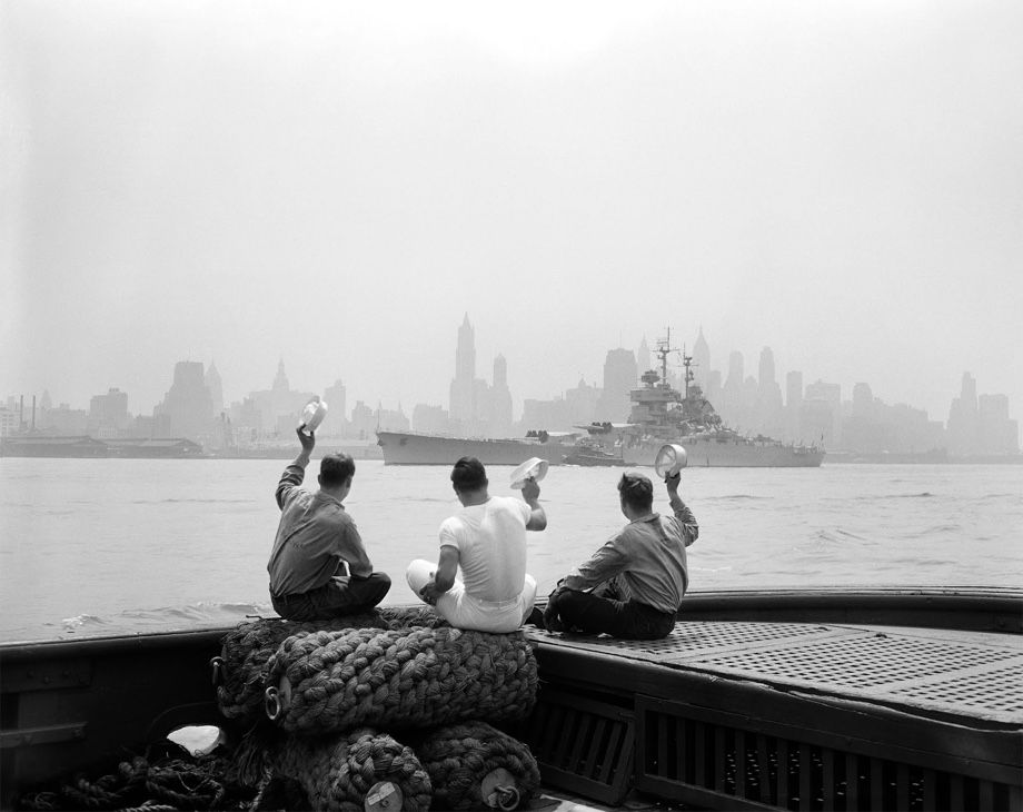 Photo from NYT archives of three men on a boat.