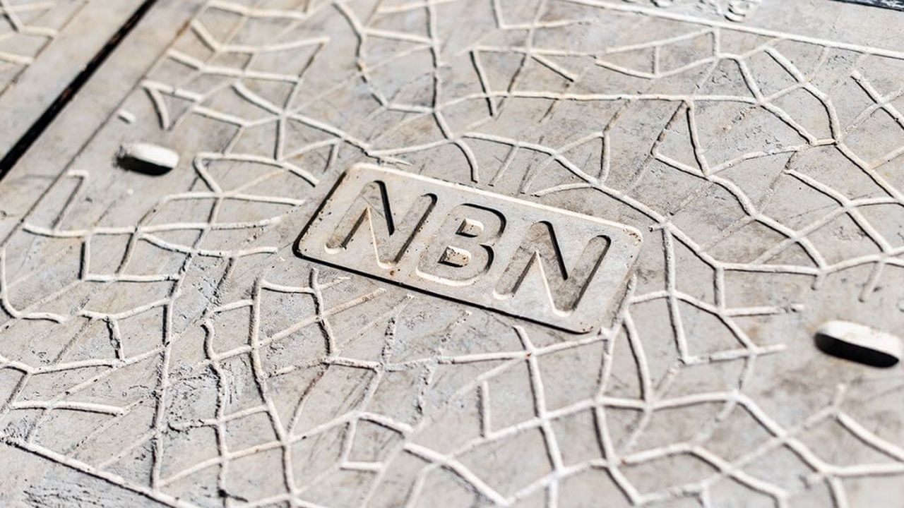 A manhole cover with the word "nbn" on it