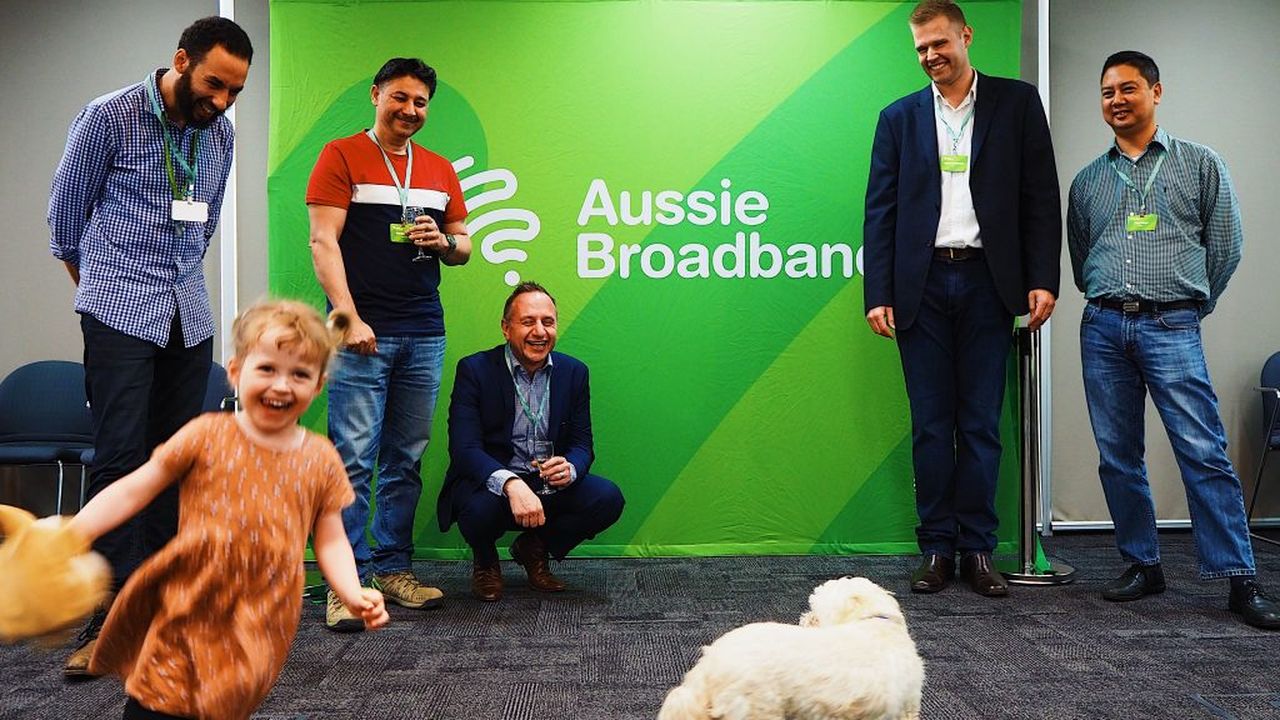 Evie Lindsay cutting the ribbon at the new Aussie Broadband office in Lynbrook