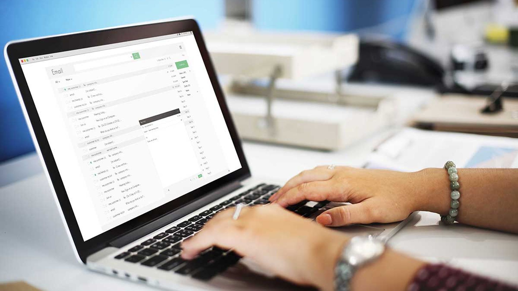 Email service being used by someone on a laptop