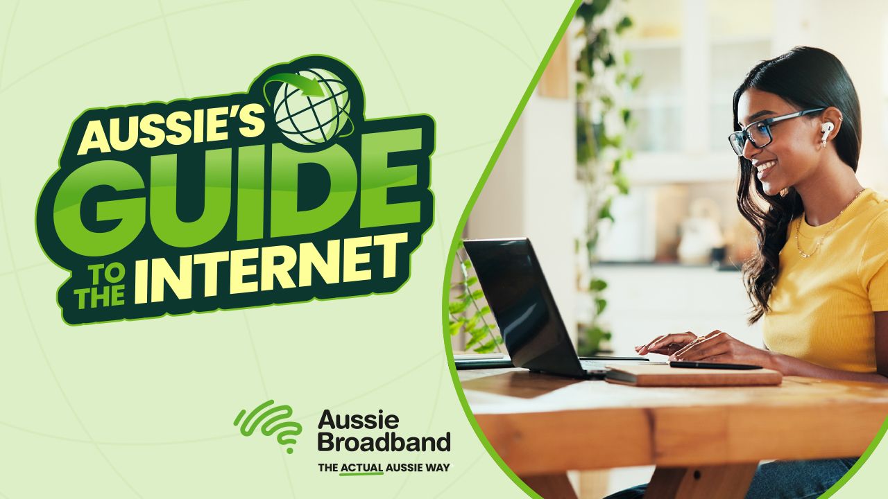 A woman in a yellow shirt uses a laptop at a table. Text reads, "Aussie's Guide to the Internet." Logo: Aussie Broadband.