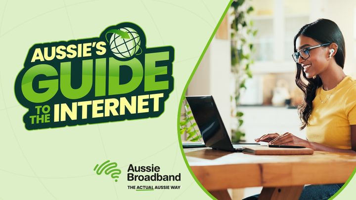 A woman in a yellow shirt uses a laptop at a table. Text reads, "Aussie's Guide to the Internet." Logo: Aussie Broadband.