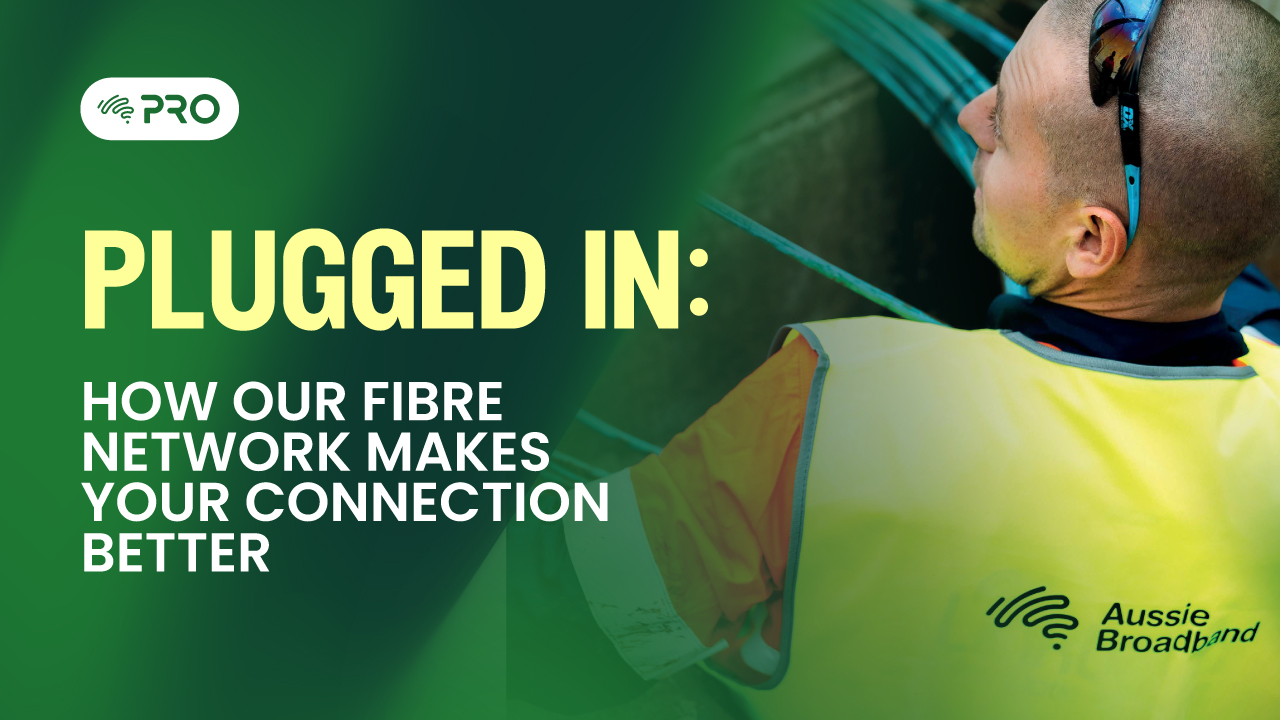 Technician wearing high-visibility vest adding fibre infrastructure