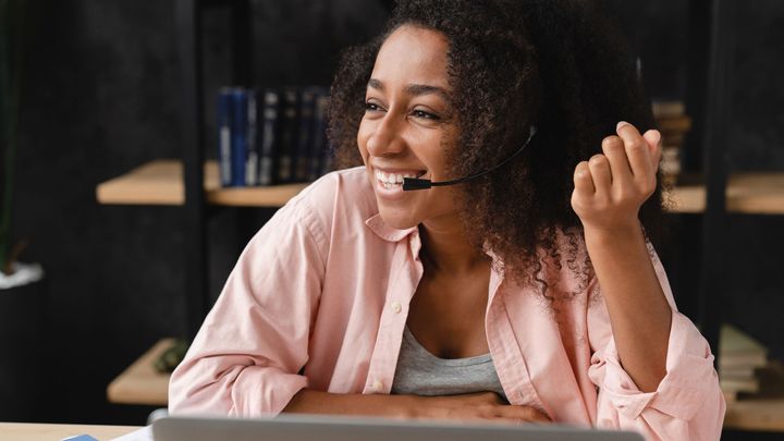 A woman talking on a headset
