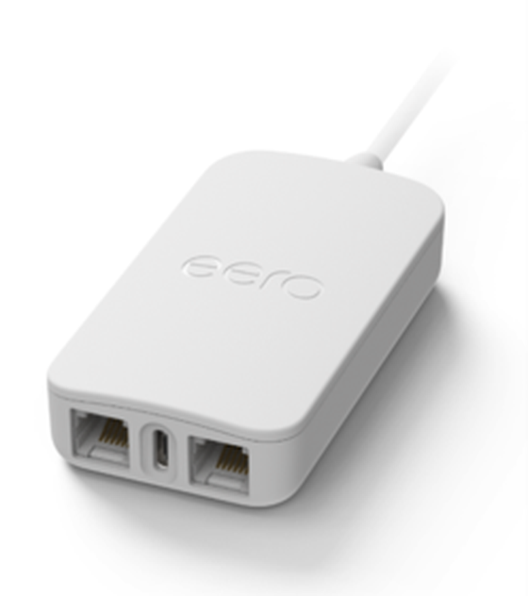 A white eero PoE adapter with dual ethernet ports and a power input, featuring a sleek design and compact size.