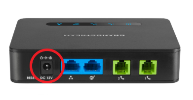 A photo of the Grandstream HT812's rear ports, with the "DC 12V" power port circled in red.