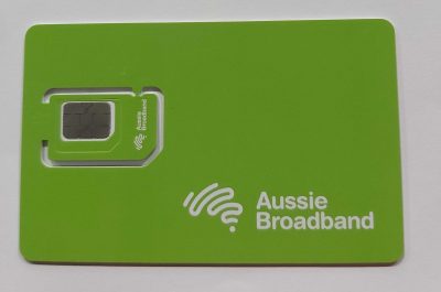 A photo of the Aussie Broadband green SIM card in its original card pop-out packaging 