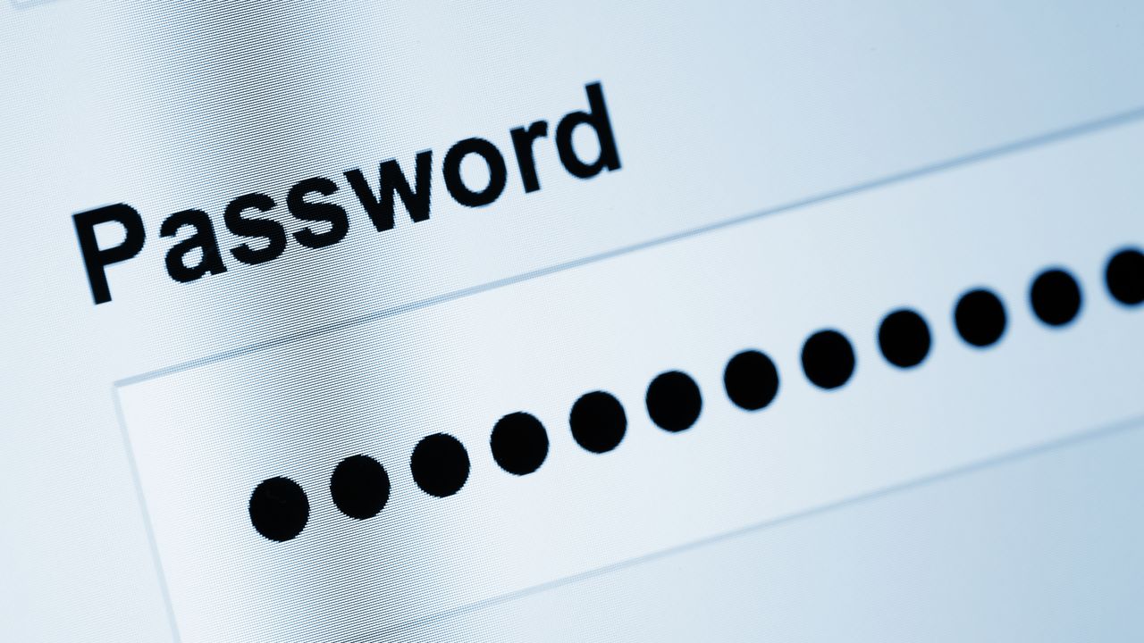 A photo of a screen with the word "Password" and black dots populated in the field below it, signifying an entered password.