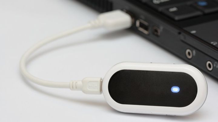 A mobile broadband dongle connected to a laptop