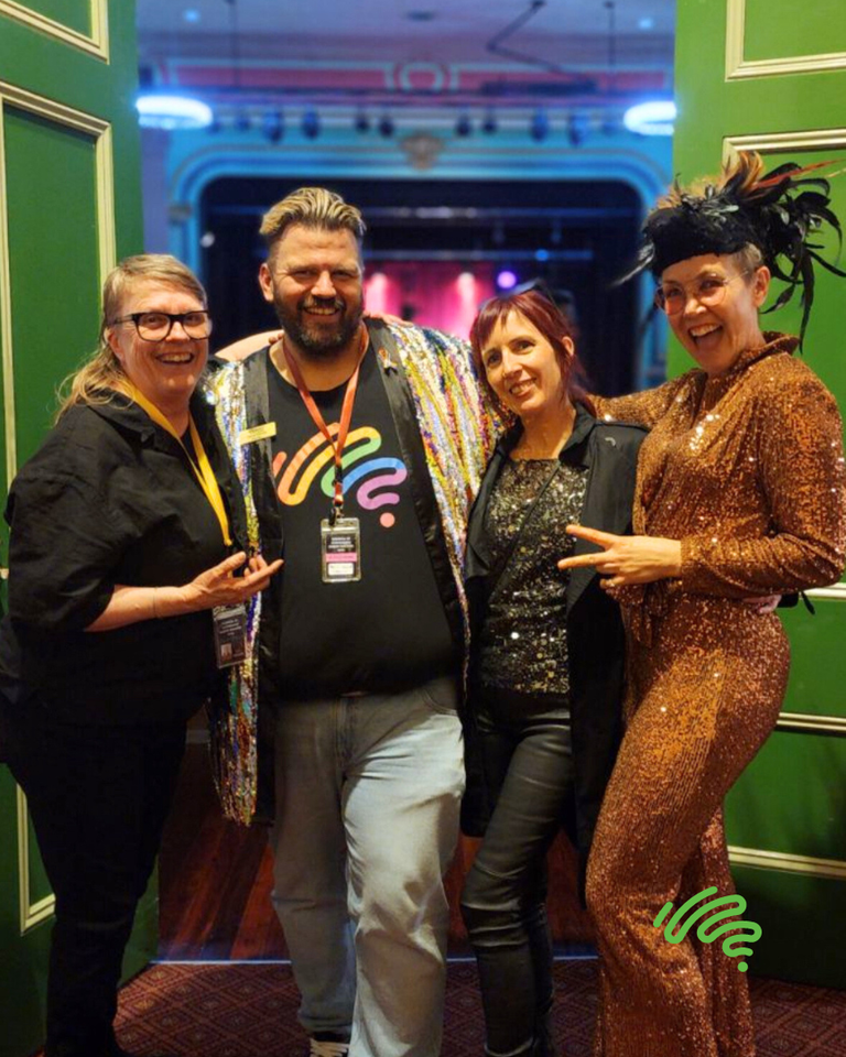 Photo of Deb Lord and Clinton Savage with performers