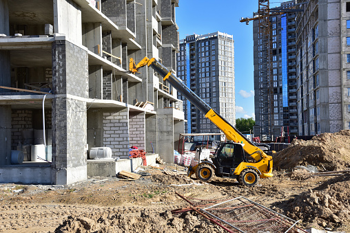 An illustration of a Telehandler in construction site.