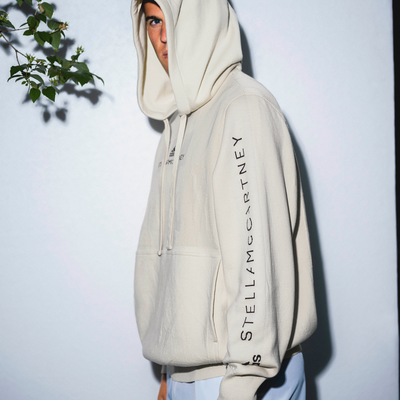 Man wearing Stella McCartney beige hoodie