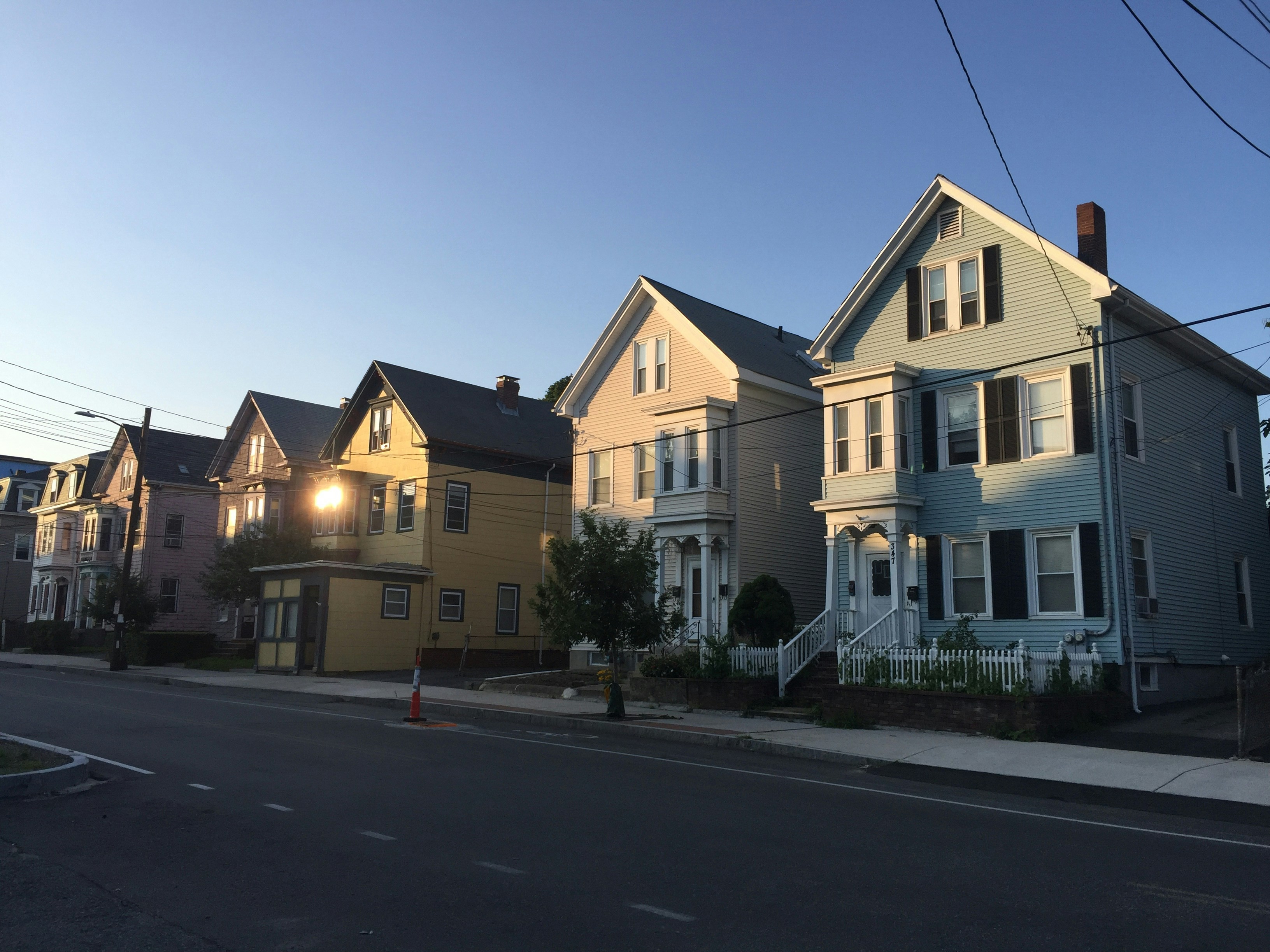 Street lined with houses and visible power lines
