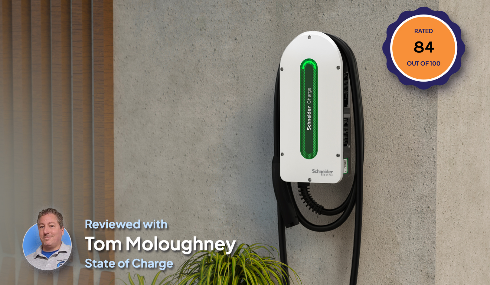 Electric vehicle charger mounted on a wall, rated 84 out of 100, with a review by Tom Moloughney from State of Charge.
