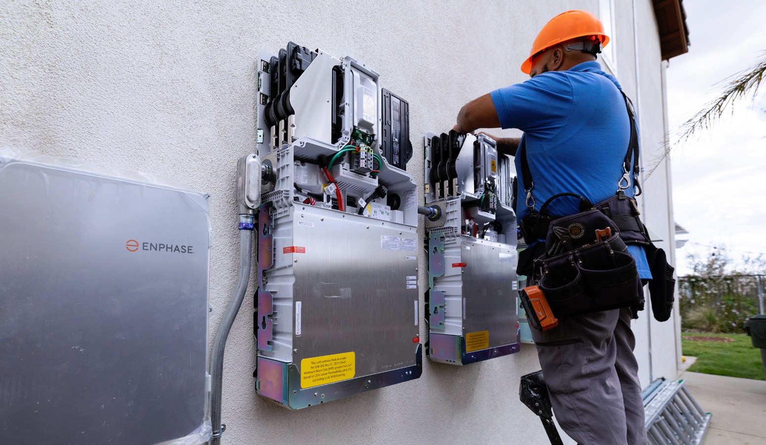 Contractor installing a home battery