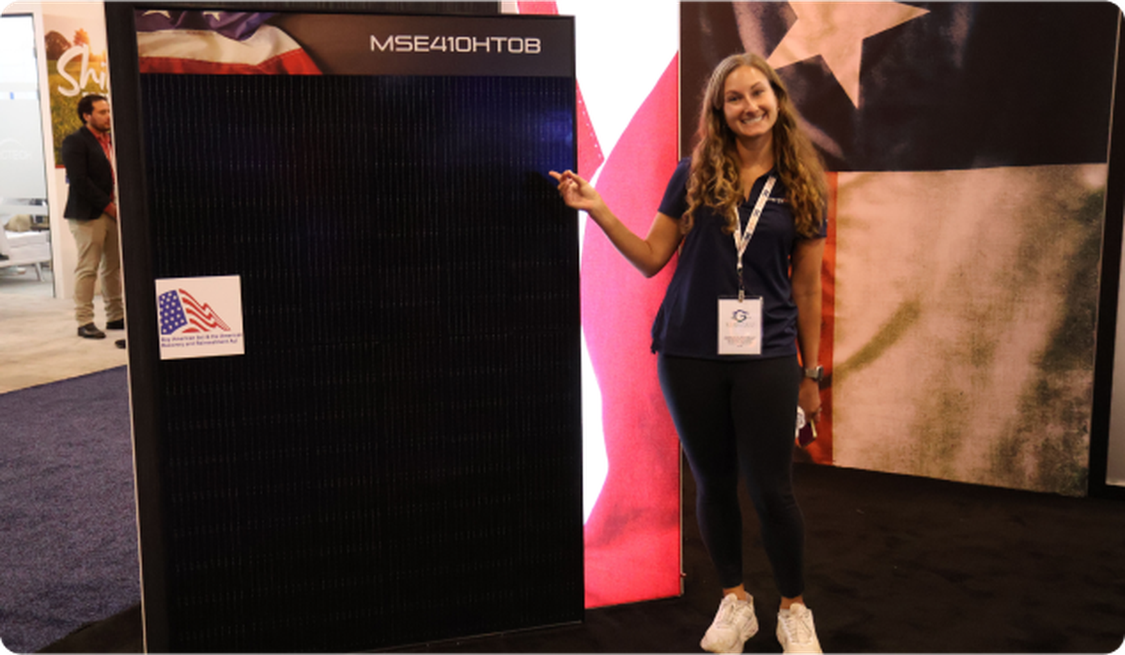 Mission Solar panel with woman pointing