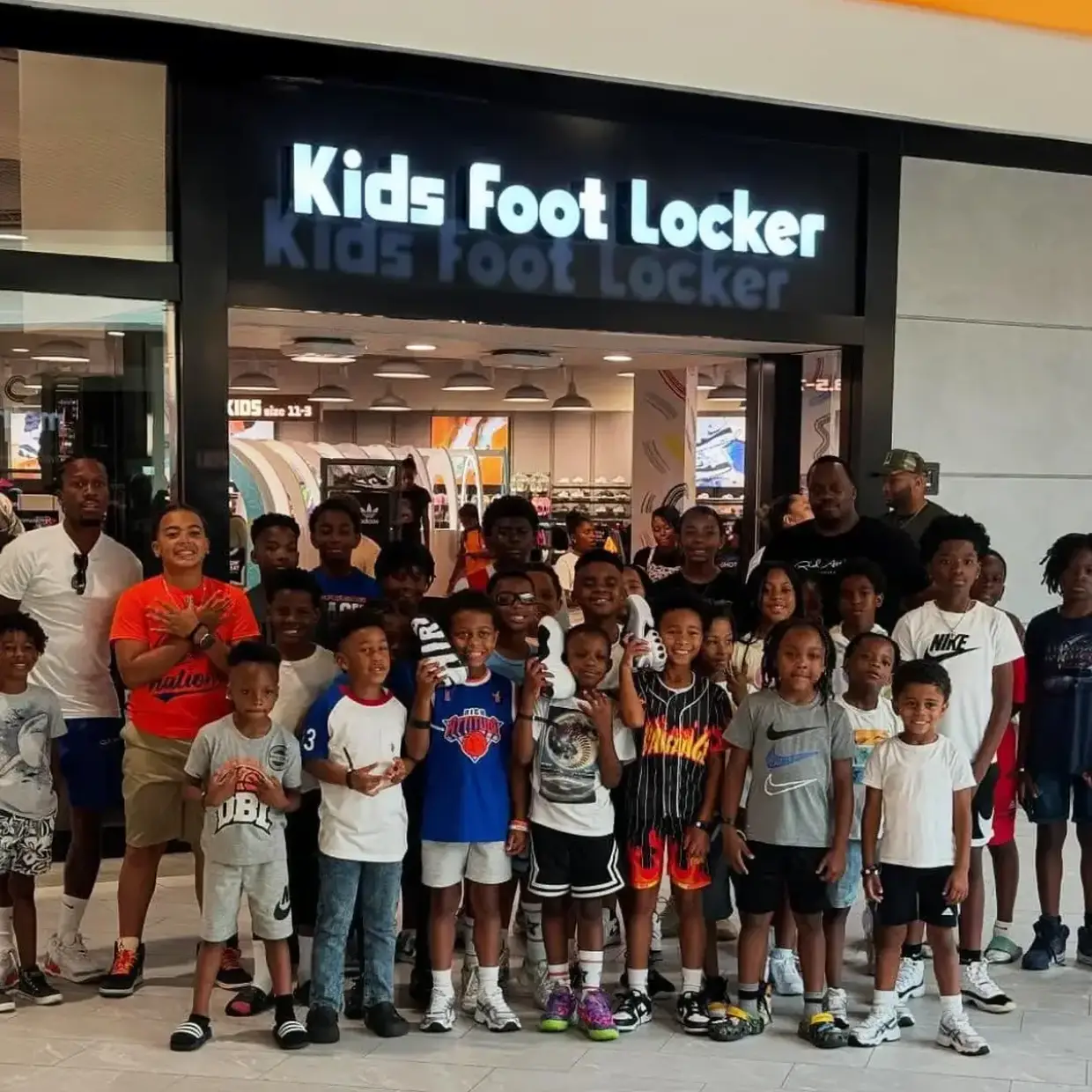 Danka basketball buying new shoes with the money they raised from their Double Good basketball fundraiser