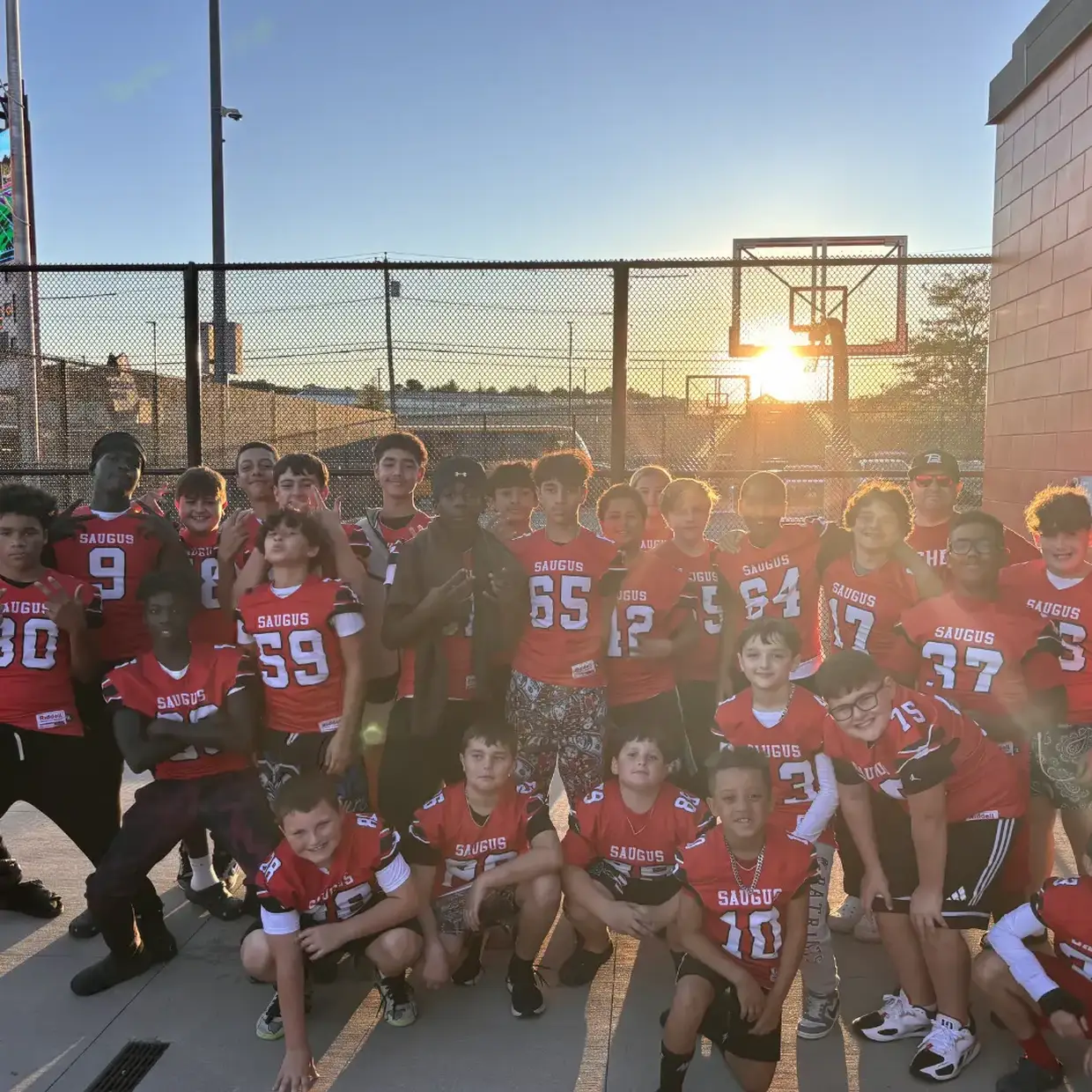 A youth football team wearing red 