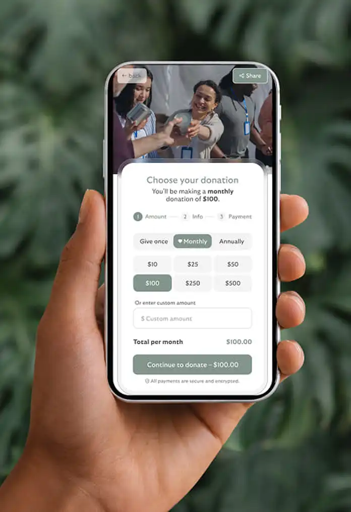 Hand holding phone with donation form