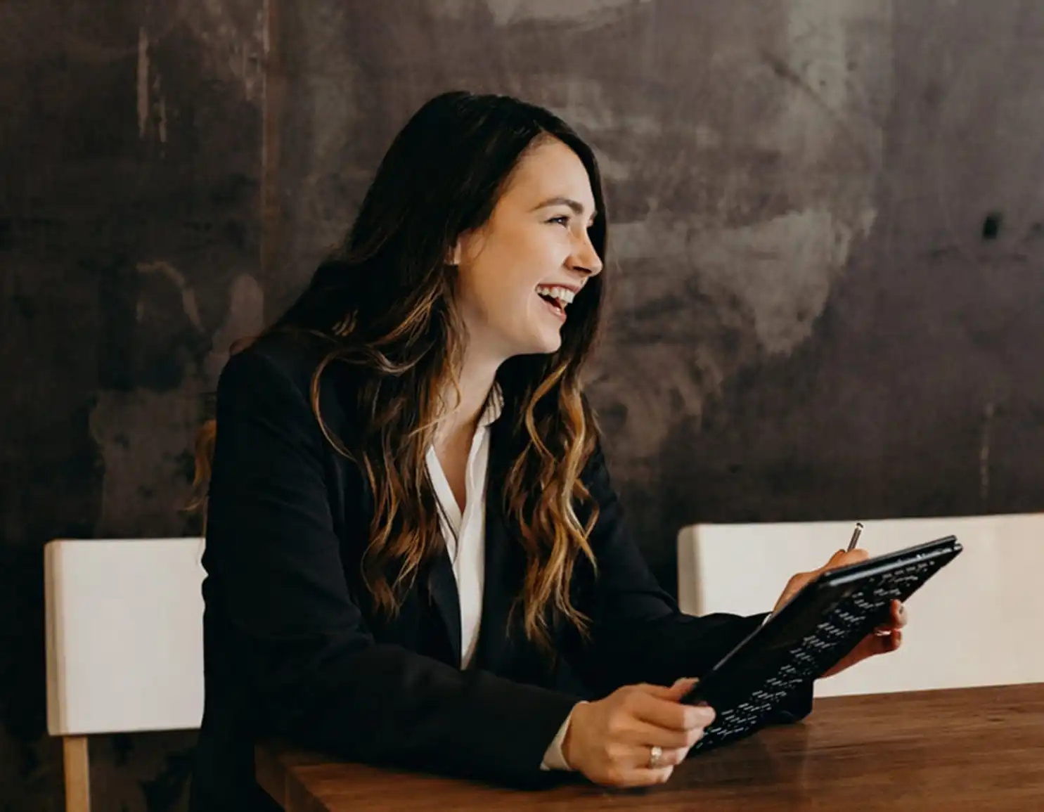 Woman with tablet looking at donation form