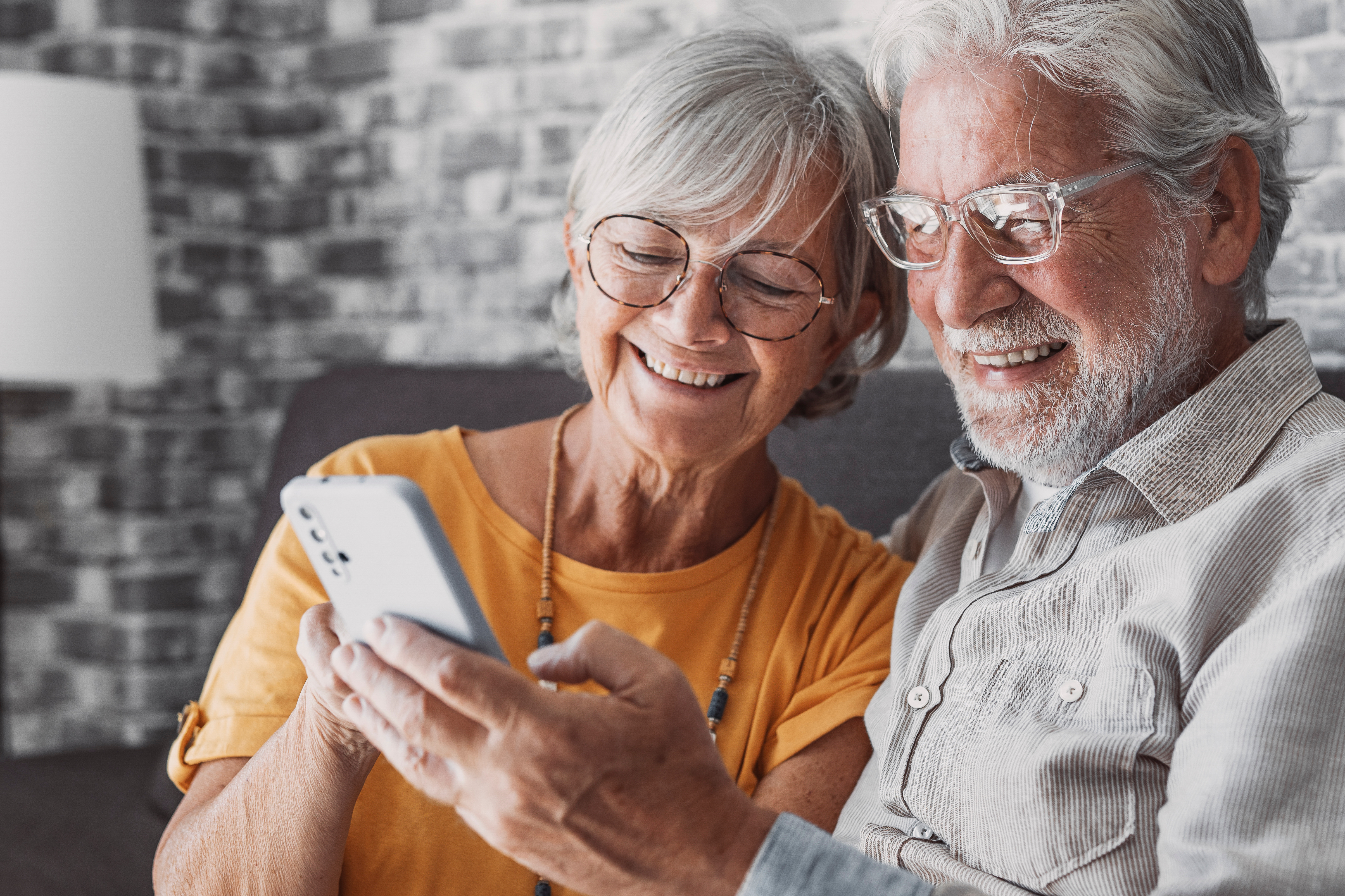 older-adult-couple-using-phone-app