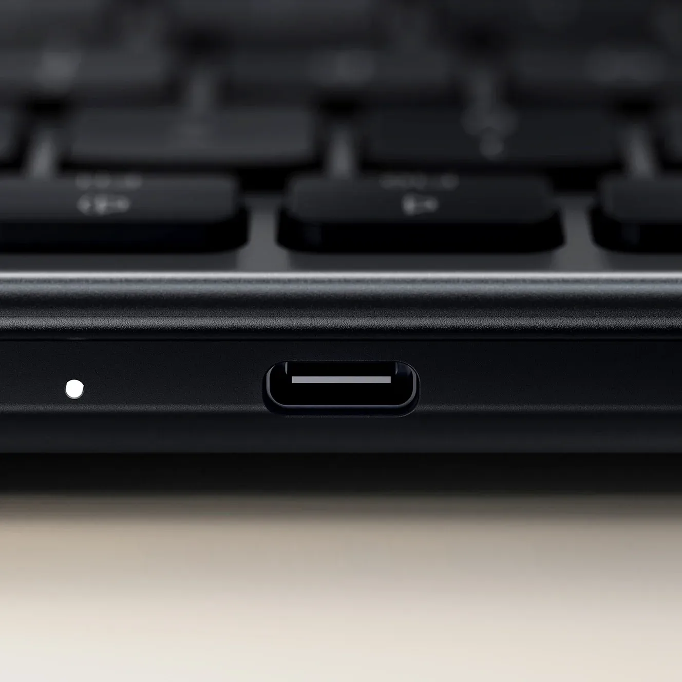 A close up of the Slim EX1 Wireless Keyboard's USB-C rechargeable battery port.