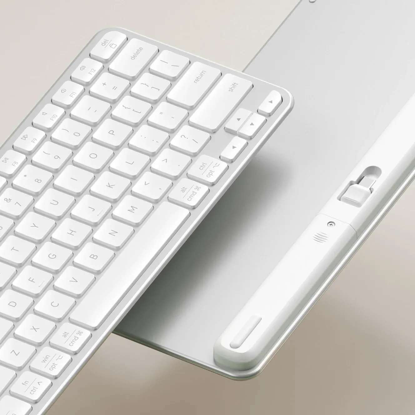 A close up of the Satechi Slim EX1 Wireless Keyboard, showing slim design and dongle.