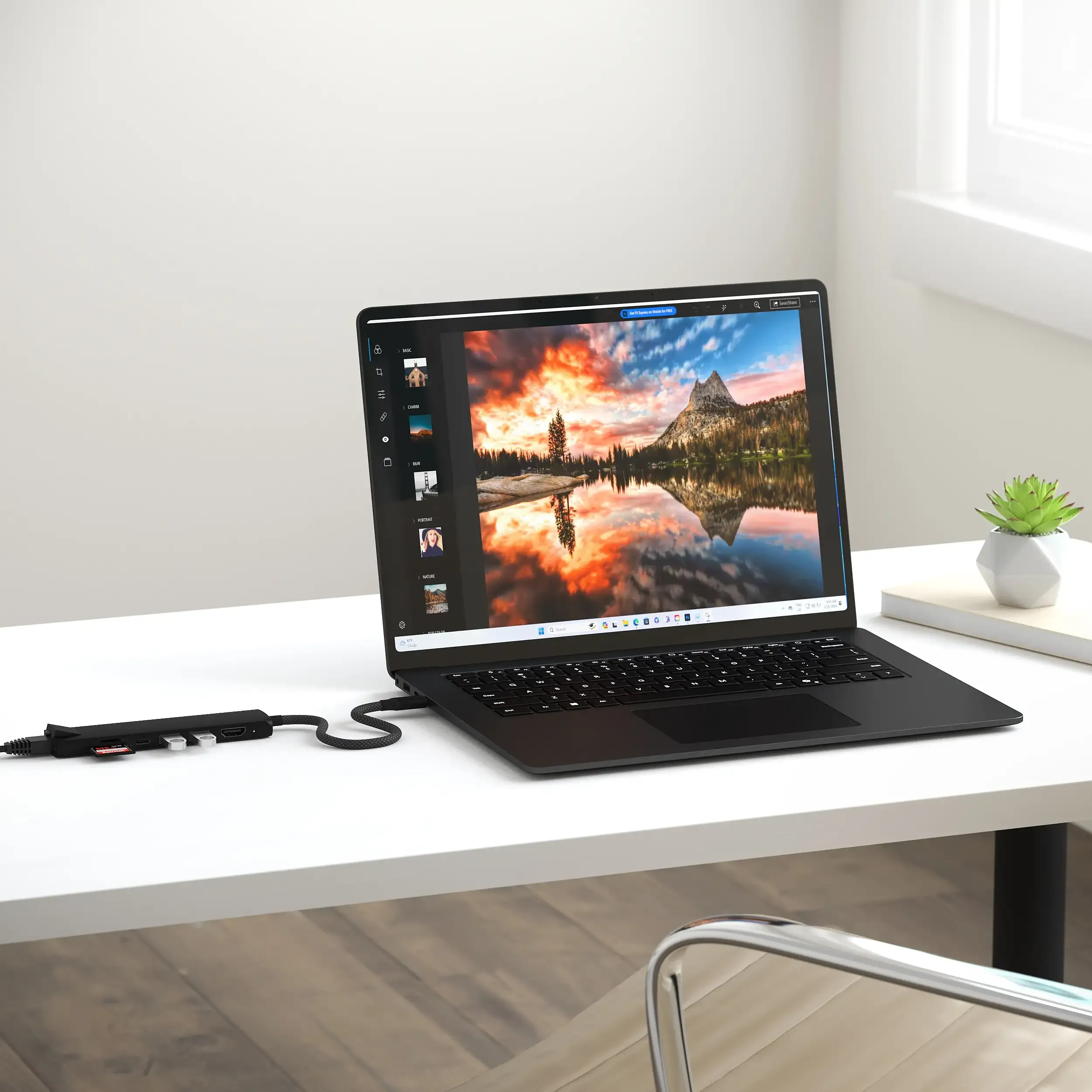 Satechi 7-in-1 USB-C Slim Multiport Adapter with Ethernet transferring high-resolution image files from flash drives and SD cards to a MacBook.