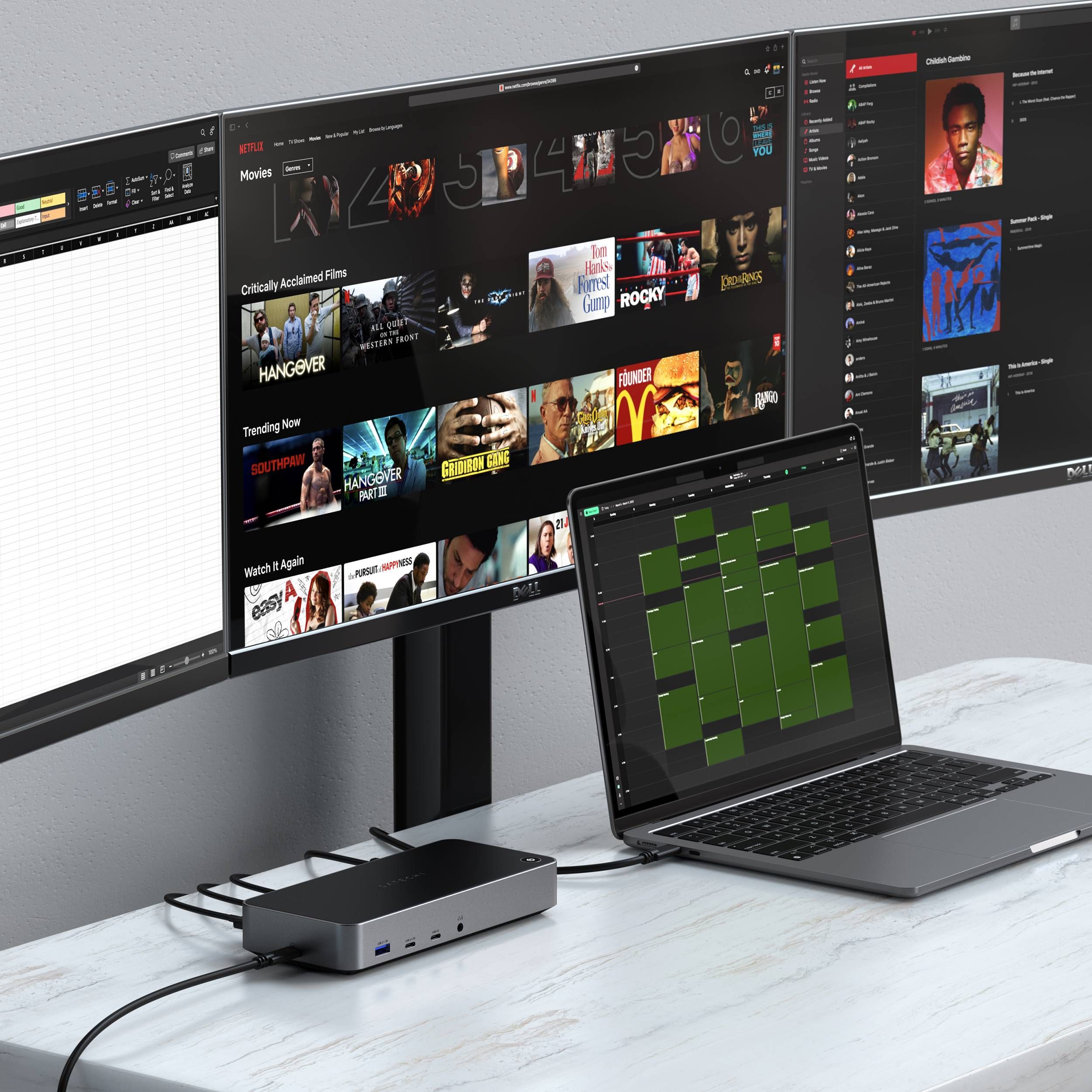 A Triple 4K Display Docking Station connected to a MacBook and three external monitors.