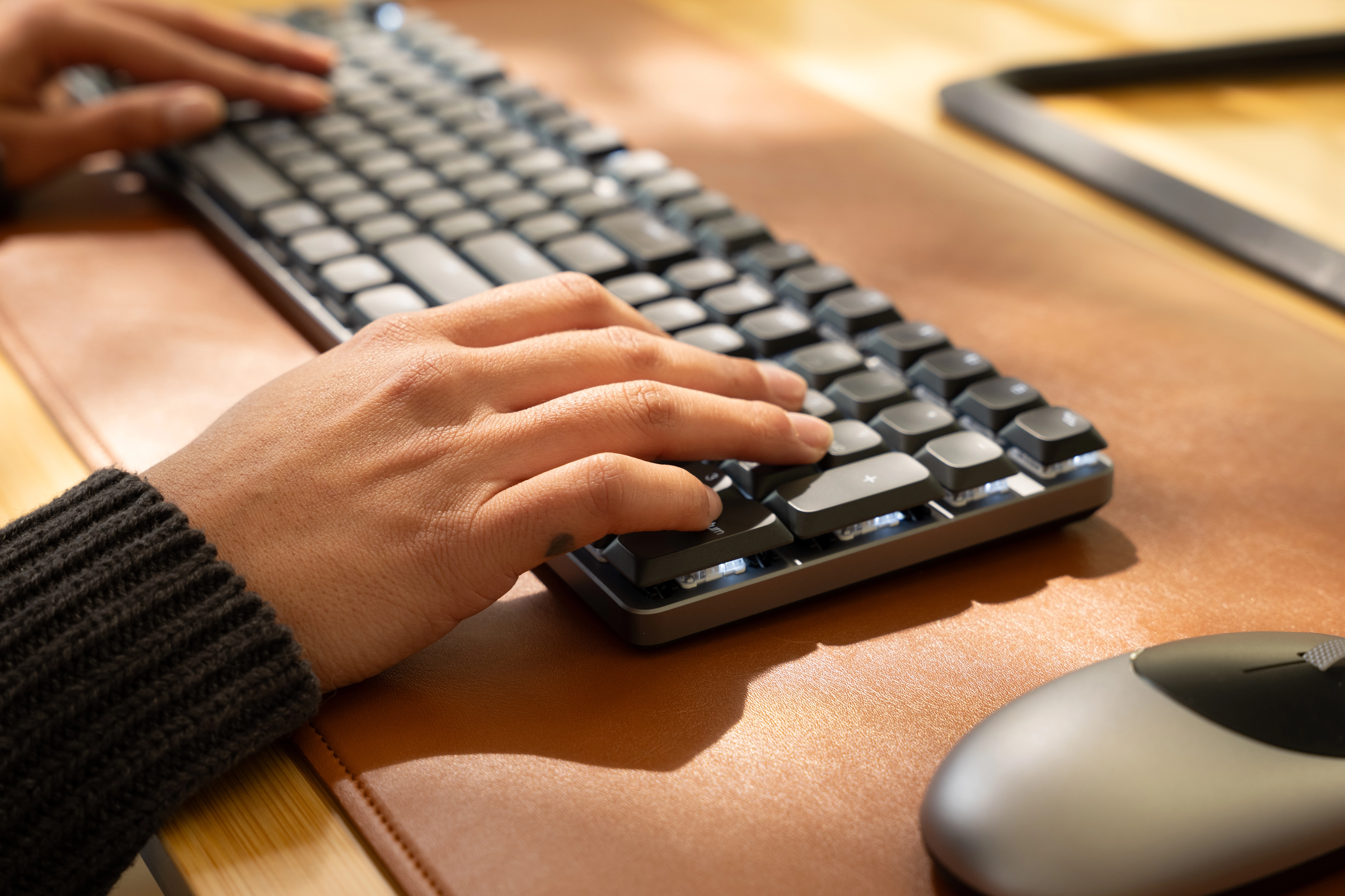 Hands typing on SM3 Slim Mechanical Backlit Bluetooth Keyboard dark