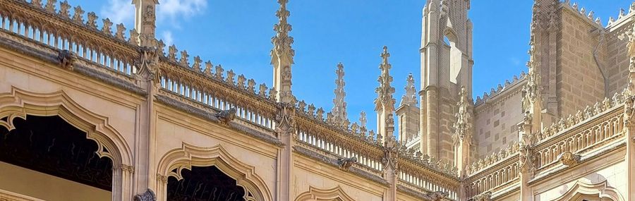 Detail of the pinnacles lining up the roof of a historic building in Toledo, Spain